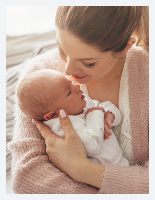 A woman holding her infant.